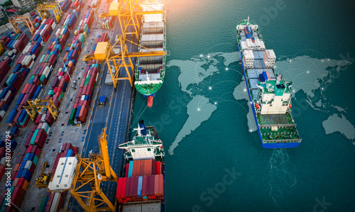 Aerial top view containers ship cargo business commercial trade logistic and transportation of international import export by container freight cargo ship with on worldmap