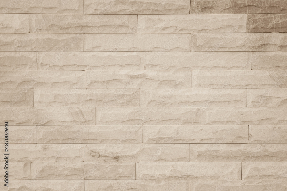 Obraz premium Cream and beige brown brick wall concrete or stone texture background backdrop.