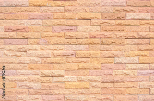 Orange brick wall texture background. Brickwork and stonework wall backdrop
