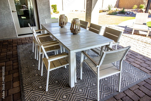 Rear Yard Pavers Pation With Large Table And Eight Chairs