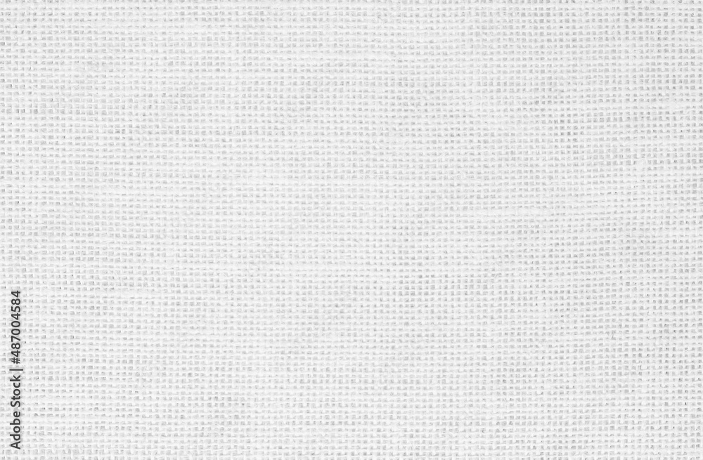 White fabric jute hessian sackcloth canvas woven gauze texture pattern in light white color blank. Natural linen and cotton cloth.
