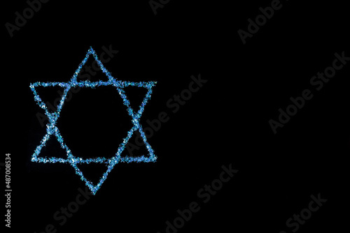 Star of David. Jewish symbol on black background. photo