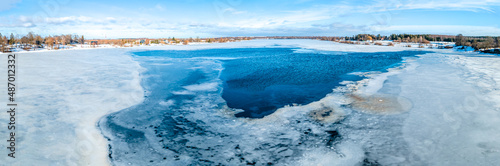 Fotografija Spring thawed ice hole on river