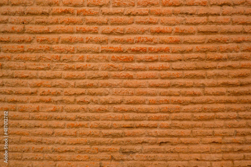 Dark brown antique red brick wall and red brick wall background.