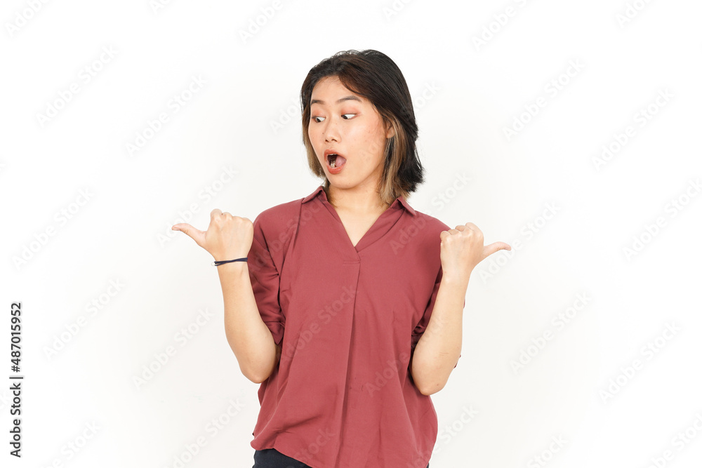 Showing and Pointing Two Product With Thumbs Of Beautiful Asian Woman Isolated On White Background Showing and Pointing Two Product With Thumbs Of Beautiful Asian Woman Isolated On White Background