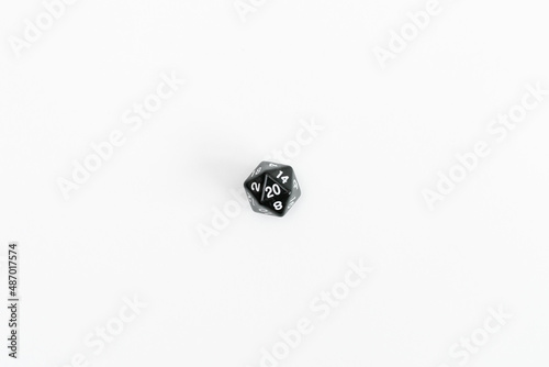 Black dice for fantasy dnd and rpg tabletop games. Board game polyhedral dice with different sides isolated on white background   © Ксения Изергина