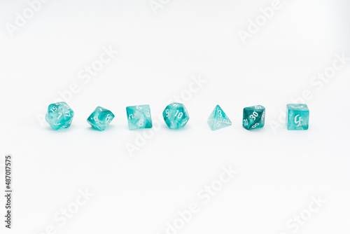 aquamarine dices for fantasy dnd and rpg tabletop games. Board game polyhedral dices with different sides isolated on white background	
