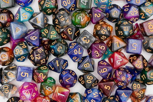 different colours dices for fantasy dnd and rpg tabletop games. Board game polyhedral dices with different sides isolated on white background	
