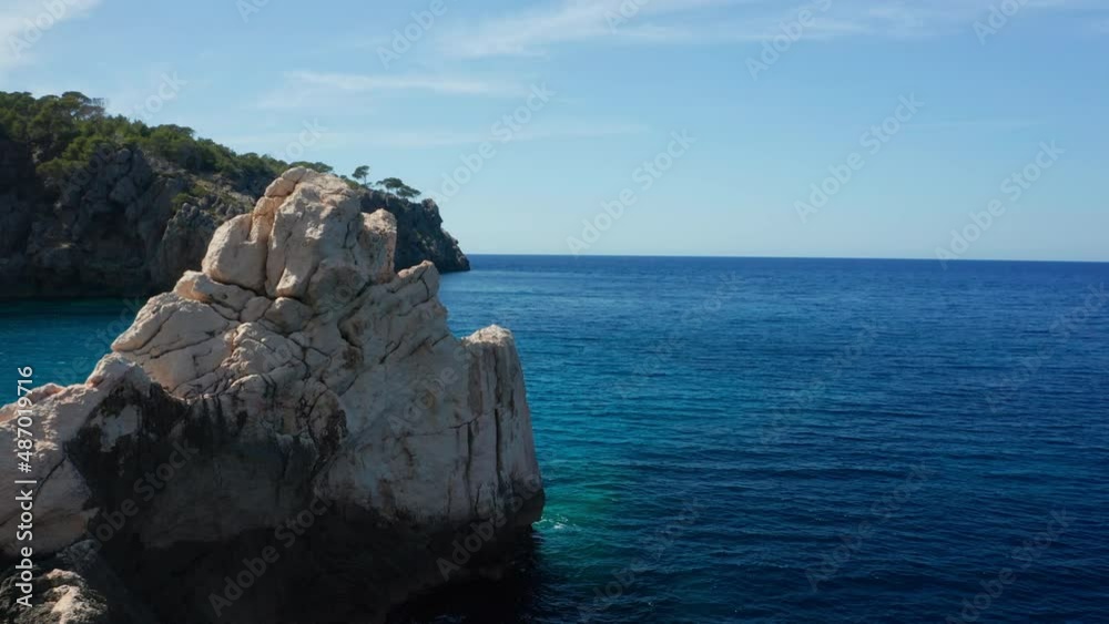 Drone Around Large Rock Formation In Sea Surrounding Ibiza Drone Around Large Rock Formation In Sea Surrounding Ibiza