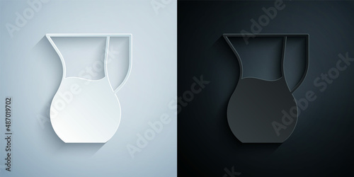 Paper cut Jug glass with water icon isolated on grey and black background. Kettle for water. Glass decanter with drinking water. Paper art style. Vector
