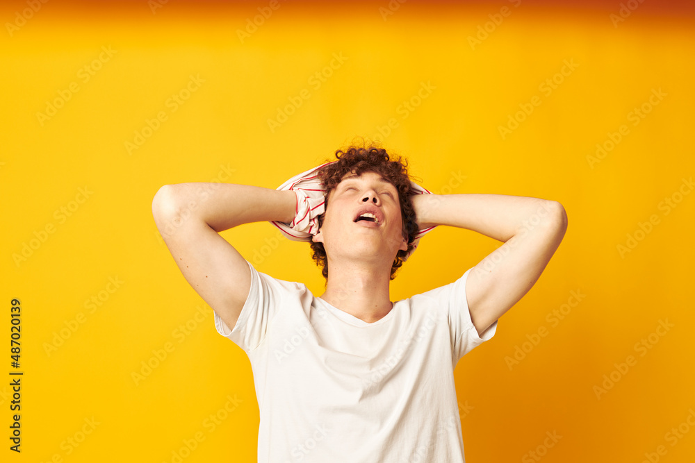 guy with red curly hair putting on a striped t-shirt posing isolated background unaltered guy with red curly hair putting on a striped t-shirt posing isolated background unaltered