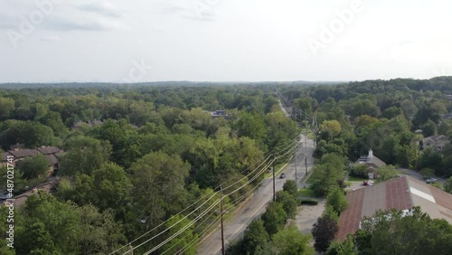Drone up over country road telephone wires
