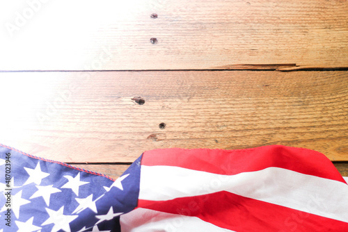 American flag Placed on a wooden background.