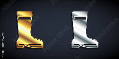 Gold and silver Fishing boots icon isolated on black background. Waterproof rubber boot. Gumboots for rainy weather, fishing, hunter, gardening. Long shadow style. Vector