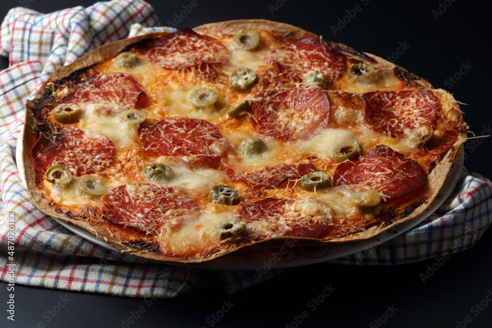 Lazy lavash-based pizza with salami and olives Lazy lavash-based pizza with salami and olives
