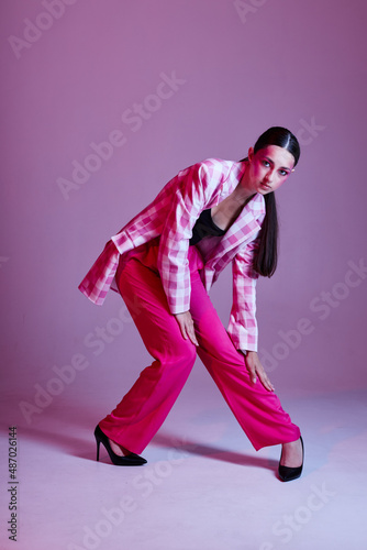 Beauty fashion female pink pants fashion clothing posing isolated background unaltered