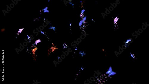 Magical butterflies of different colors fly, leaving behind a trail of sparkles. An amazing phenomenon of nature. The space is filled with amazingly beautiful butterflies of all shades.