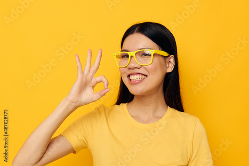 woman with Asian appearance hands gesture emotions cropped view isolated background unaltered