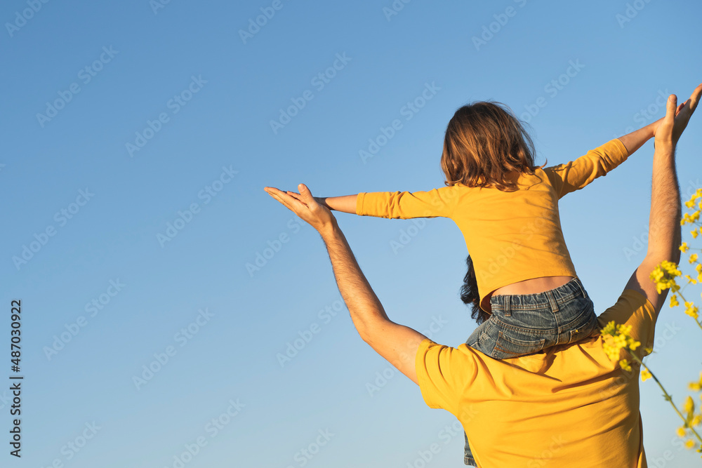 father's day. Dad and son playing together outdoors on a summer. Happy family, father, son at sunset. The concept of organic farming and healthy lifestyle, happiness and joy father's day. Dad and son playing together outdoors on a summer. Happy family, father, son at sunset. The concept of organic farming and healthy lifestyle, happiness and joy