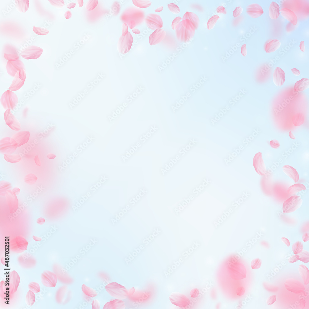 Sakura petals falling down. Romantic pink flowers frame. Flying petals on blue sky square background. Love, romance concept. Nice wedding invitation.