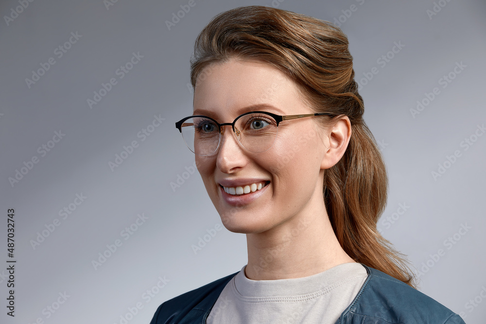 Elegant chic female model in fashion glasses. Closeup portrait