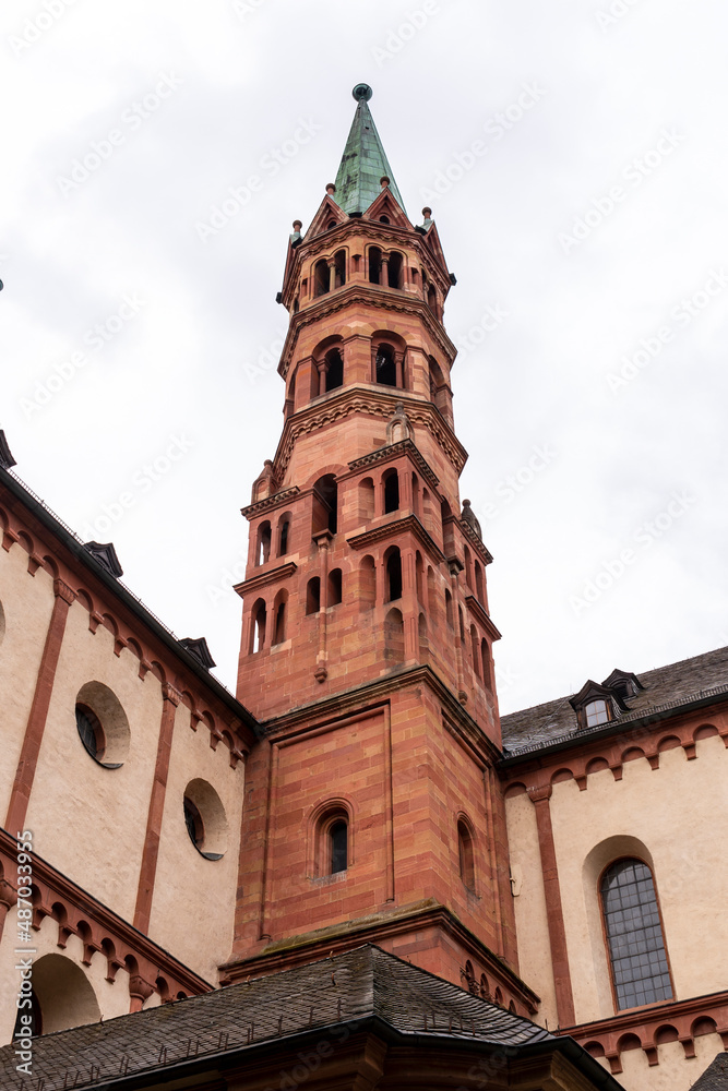 Brick colored towers with bronze green roofs at Würzburger Cathedral or Würzburger Dom seen in frog perspective from the nave side