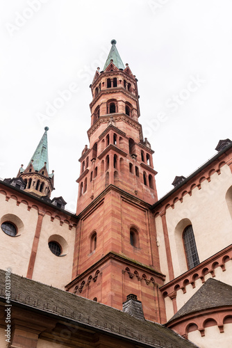 Brick colored towers with bronze green roofs at Würzburger Cathedral or Würzburger Dom seen in frog perspective from the nave side
