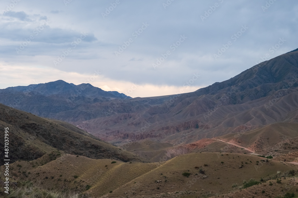 Beautiful off-road trail canyon among mountains. The road to Bartogay reservoir from Assy plateau. Beautiful off-road trail canyon among mountains. The road to Bartogay reservoir from Assy plateau.
