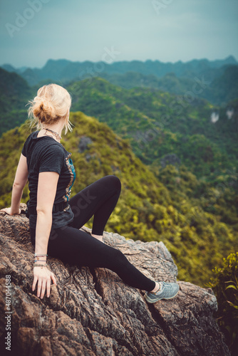 woman sitting on a rock