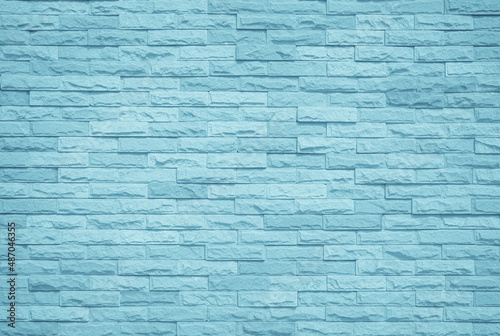 Brick wall painted with pale blue paint pastel calm tone texture background. Brickwork bricks design stack backdrop.