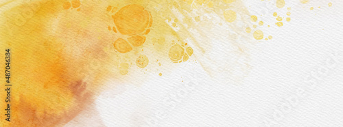 Abstract gold and yellow watercolor paint background.