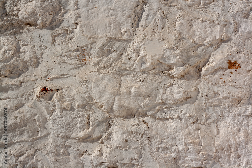 Fototapeta premium Formless wall covered with mortar. Horizontal photo.