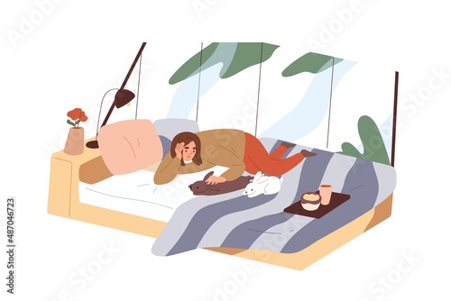 Woman relaxing with home rabbits on bed. Happy person resting with bunnies in...