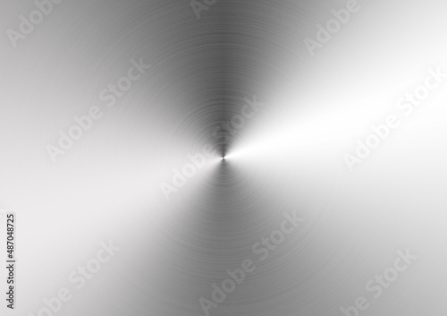 Background of brushed metal aluminum plate with reflections in circular shape.