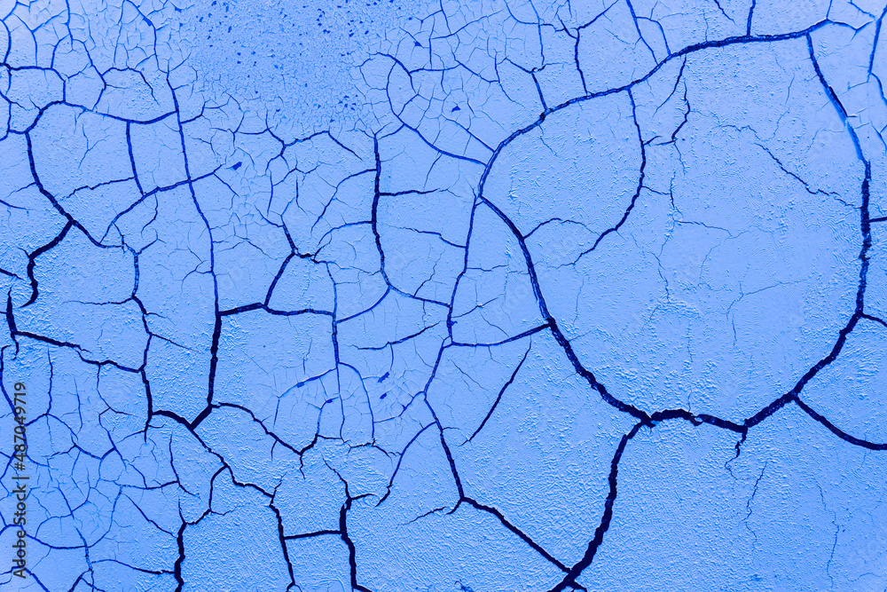 Cracked and damaged painted surface of a building or wall. Texture, aged paint background Cracked and damaged painted surface of a building or wall. Texture, aged paint background