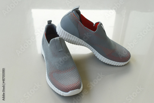 sports style men's shoes on white background.