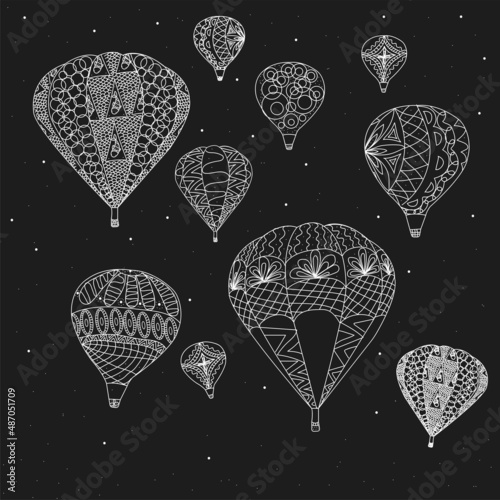 Balloons made with white paint on a black background. Balloons with patterns