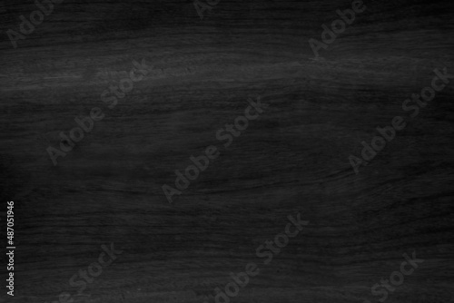 Black vintage painted plywood boards wall antique old style background. Grunge dark old wood texture wooden hardwood decoration.