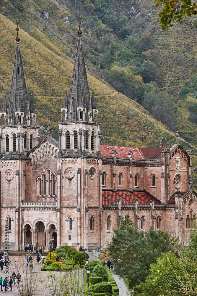 Picturesque red stone basilica and mountains in Covadonga sanctuary. Asturias, Spain