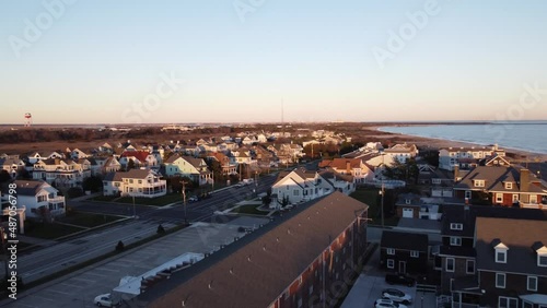 A beautiful aerial drone shot, flying over beachfront houses in the suburbs of Cape May New Jersey, Cape May County. photo