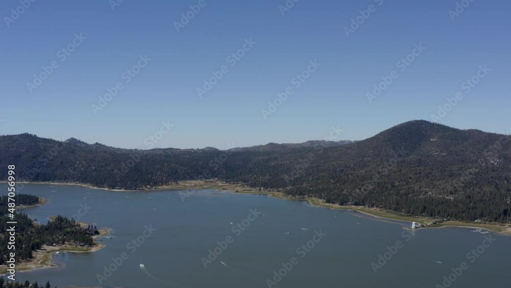 A stunning drone shot at high altitude flying towards the mountain skyline at Big Bear Lake in San Bernardino County, California. A stunning drone shot at high altitude flying towards the mountain skyline at Big Bear Lake in San Bernardino County, California.