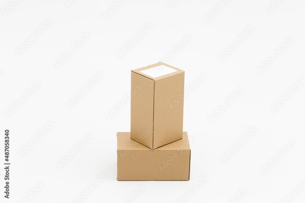 Obraz premium Two closed cardboard boxes on a white background