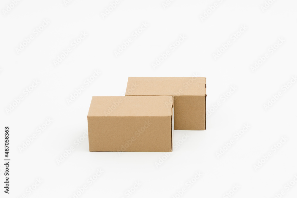 Two closed cardboard boxes on a white background Two closed cardboard boxes on a white background