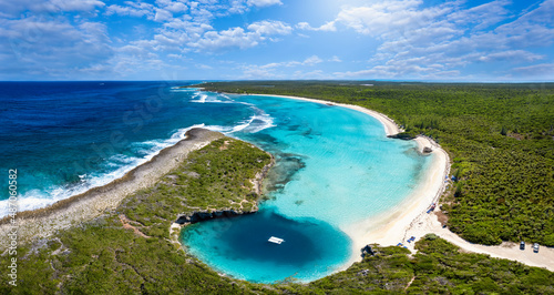 Fototapeta Naklejka Na Ścianę i Meble -  Panoramic aerial view to Dean's blue hole with the connecting lagoon and beautiful beach with turquoise sea, Long Island, Bahamas