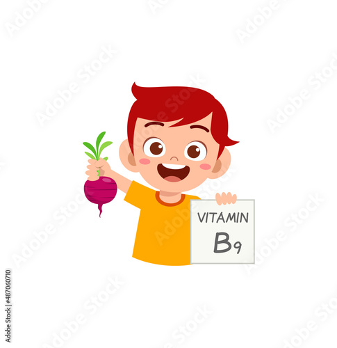 cute little boy holding fruit and vitamin card