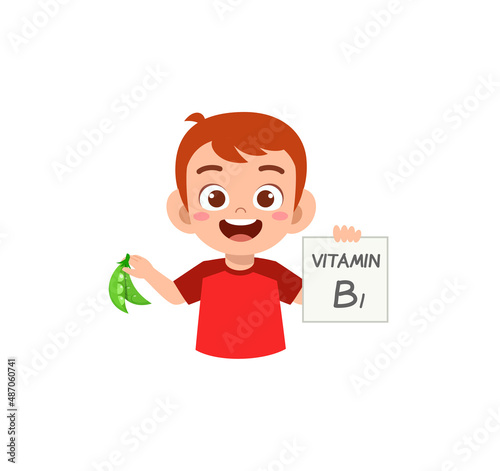 cute little boy holding fruit and vitamin card