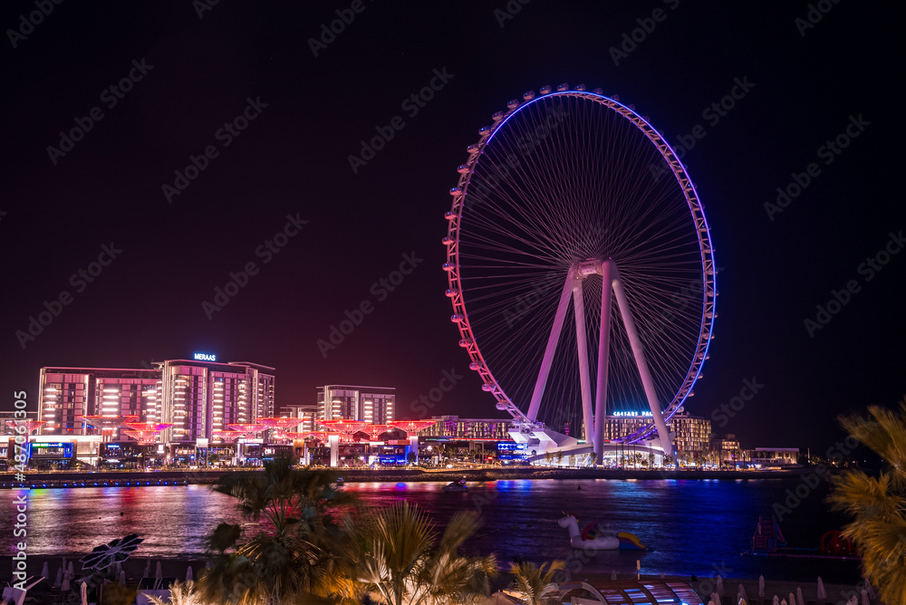 Beautiful Dubai eye or Ain Dubai on the Jumeirah beach at night. Beautiful lights of the ferris wheel in Dubai 