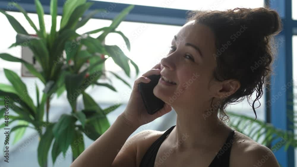 Attractive woman in spa center talking on the phone Attractive woman in spa center talking on the phone