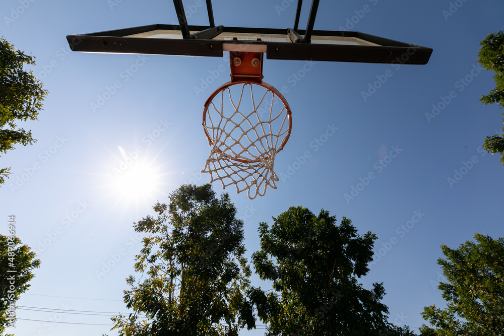 Basketball hoop with blue sky with low angle view Stock-Foto | Adobe Stock