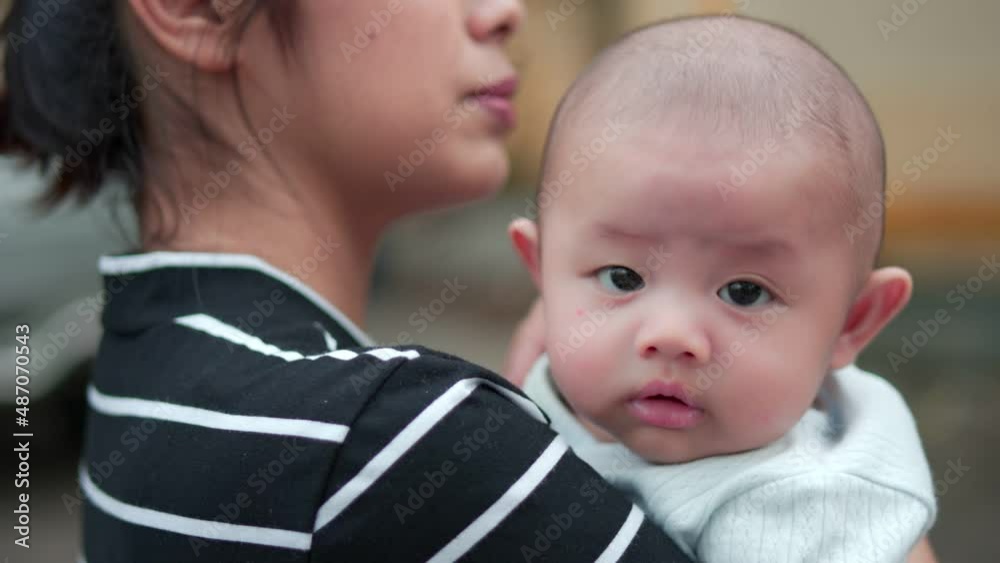 Cute, newborn Asian baby boy. Family happy, Asian young mother is carrying and taking care with love. Little innocent new infant child in first day of life. Mother day concept. Cute, newborn Asian baby boy. Family happy, Asian young mother is carrying and taking care with love. Little innocent new infant child in first day of life. Mother day concept.